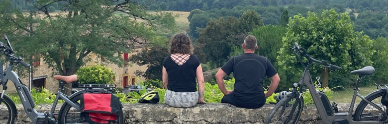 two people with their bikes looking at the landscape