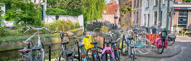bikes parked by a bridge in a city